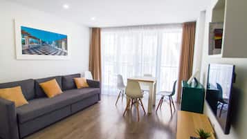 Family Apartment, 2 Bedrooms | Living area | 45-inch TV with digital channels