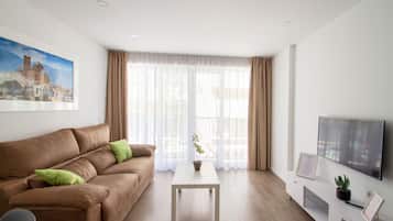 Apartment, 1 Bedroom | Living area | 45-inch TV with digital channels