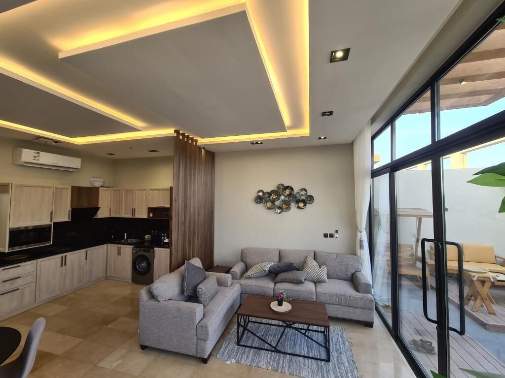 Family Villa, Multiple Beds | Living area | 45-inch Smart TV with cable channels