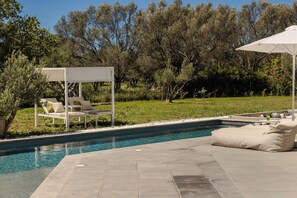 Outdoor pool, pool umbrellas, sun loungers