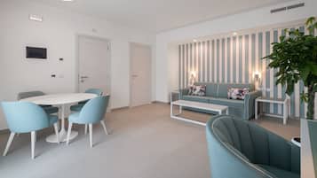 Family Suite, 2 Bedrooms, Balcony, Partial Sea View | Living area