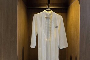 A white garment hanging in a wooden interior space. - Memory Graceful Hotel（Changzhou Yancheng Wuyue Plaza） (Changzhou)