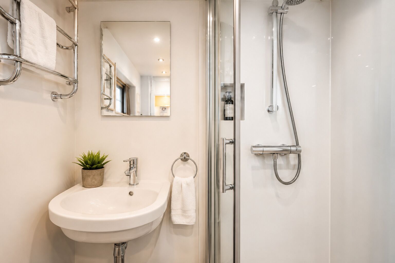 Shower, hair dryer, towels, toilet paper