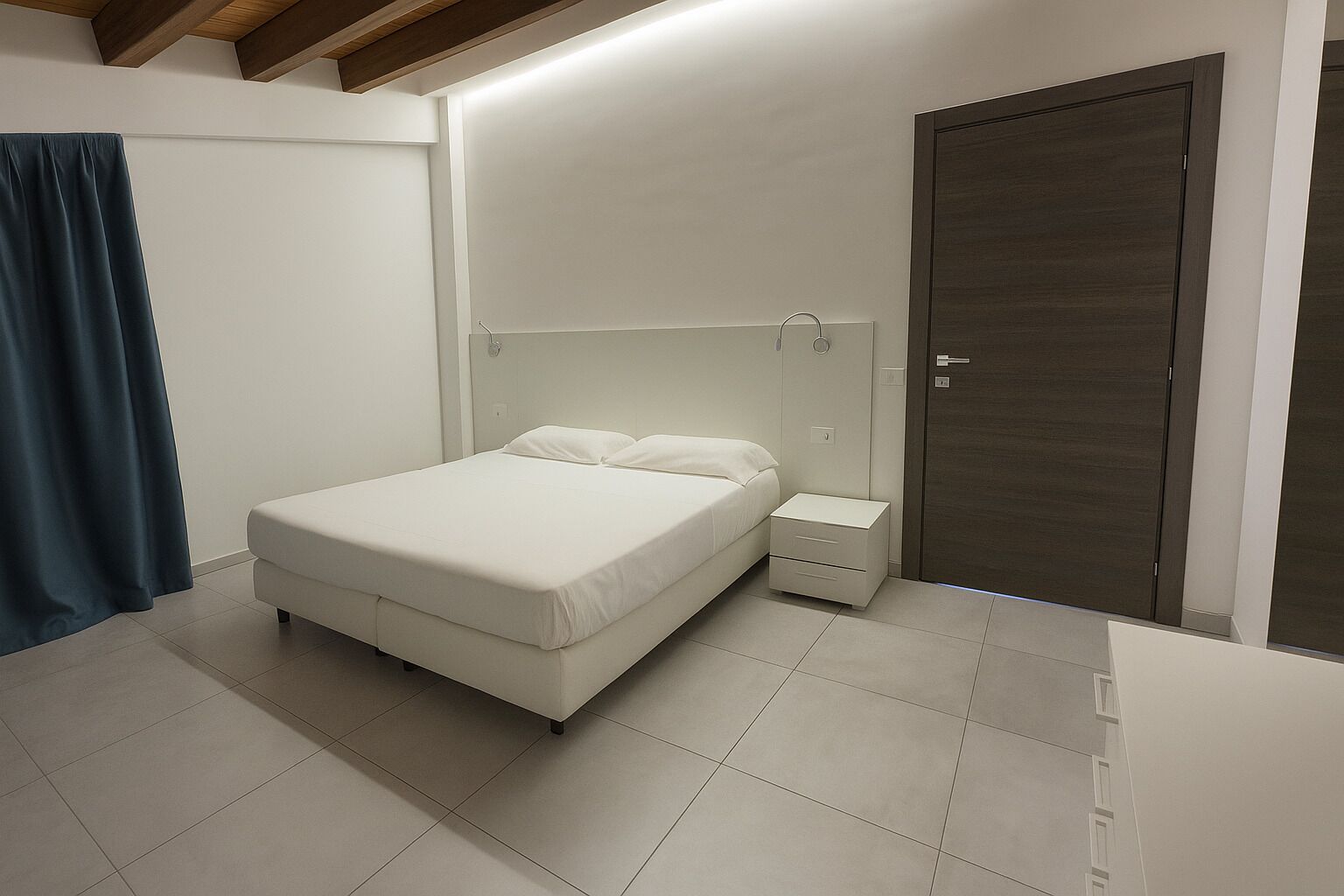 A bedroom with a bed, bedside table, and a wardrobe.