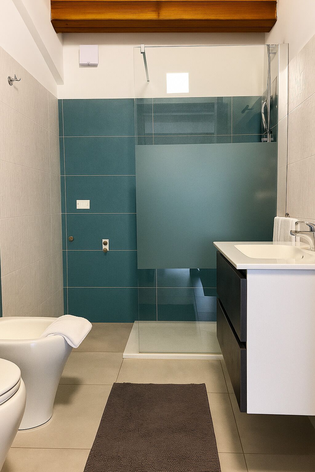 A modern bathroom with a toilet, sink, and shower.