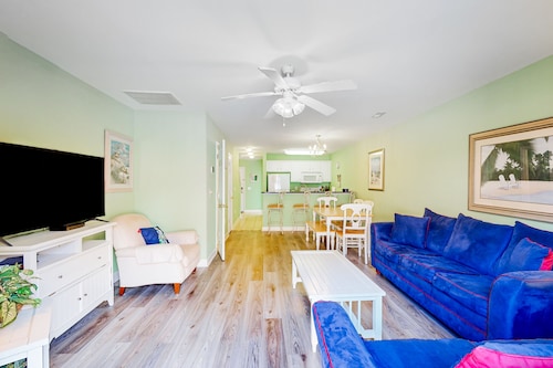 Dog-friendly townhome steps from the sand with private patio, central AC, & W/D