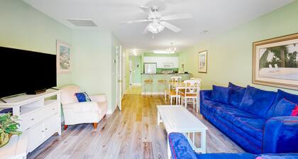 Dog-friendly townhome steps from the sand with private patio, central AC, & W/D