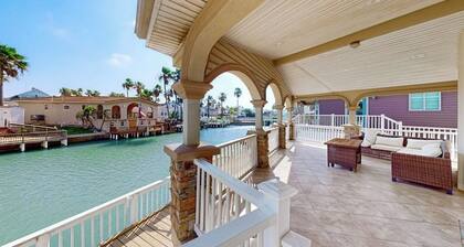 Single-level waterfront retreat with a furnished patio, AC, & washer/dryer