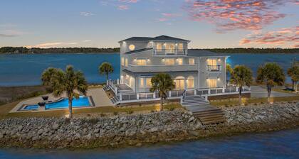 Luxurious private island home with pool, wraparound deck, & firepit