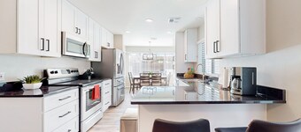 Updated home with enclosed yard, pool, grill, full kitchen, games, W/D, & AC