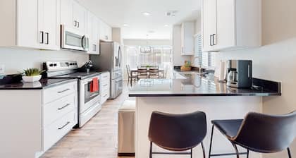 Updated home with enclosed yard, pool, grill, full kitchen, games, W/D, & AC