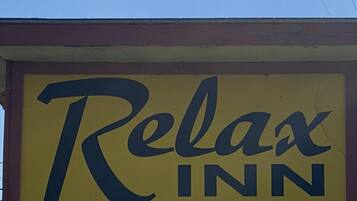 A sign for 'Relax Inn Kitchens'.