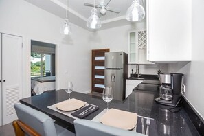 Fridge, microwave, oven, stovetop - New modern condo 3 minute walk to West Bay Beach (West Bay)