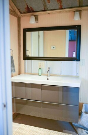 Shower, hair dryer, towels, toilet paper