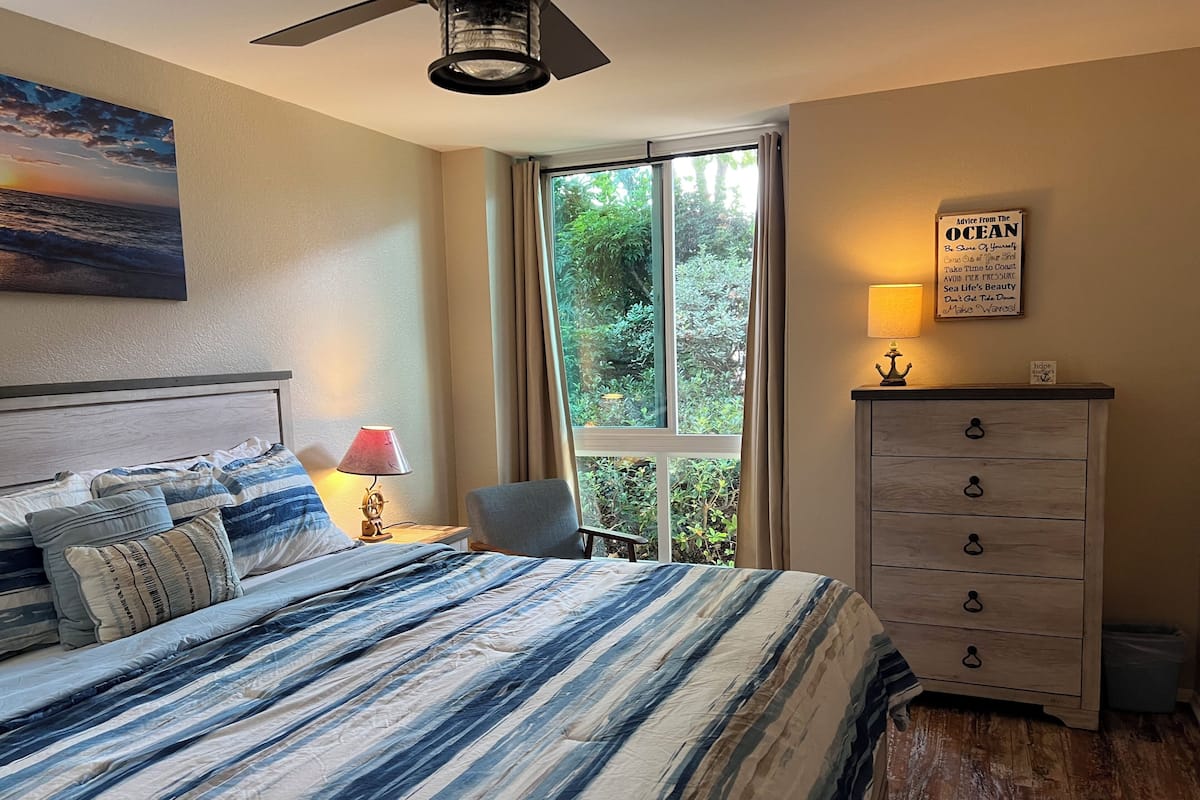 Condo, 1 King Bed with Sofa bed, Pool Access, Garden View (A102) | 1 bedroom, individually decorated, individually furnished, free WiFi