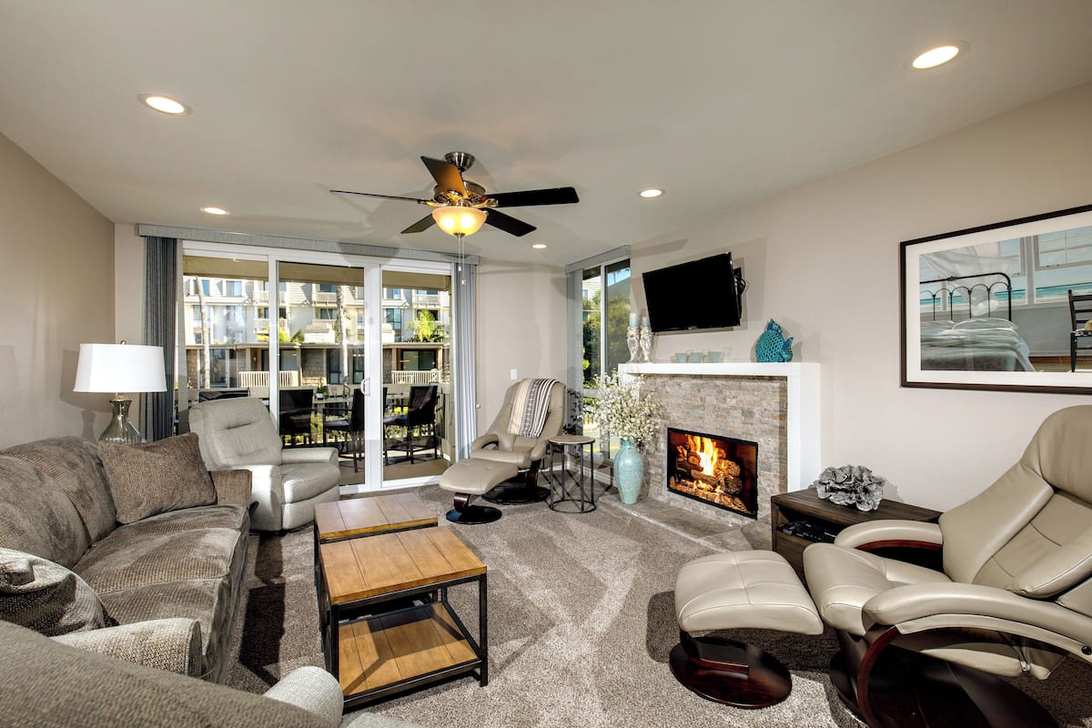 Condo, Multiple Beds, Pool Access, Garden View (A12 ) | Living area | TV, fireplace