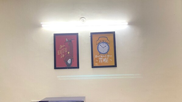 Two framed wall art pieces with motivational messages.