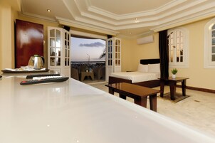 Family Room | Minibar, in-room safe, individually furnished, desk