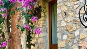 A stone building with a wooden door and steps leading up to it. - Valbonne Villa with fantastic view and large swimming pool (Valbonne)