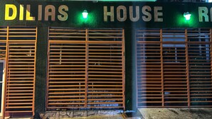 A building facade with the name "DILIAS HOUSE" in large letters. - Dilias house RANCH (Sabana Larga)
