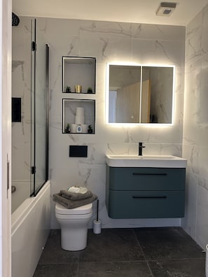 Hair dryer, towels, soap, toilet paper
