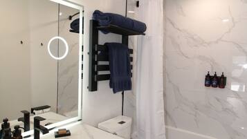 Shower, eco-friendly toiletries, hair dryer, towels