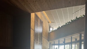 A modern lounge area with a fireplace, seating, and large windows. - Amazing two story loft condo at Snowbird, UT: March 21-28, 2026: Timeshare. (Snowbird)
