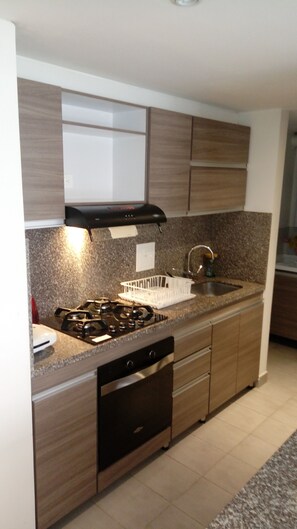 Fridge, microwave, stovetop, coffee/tea maker