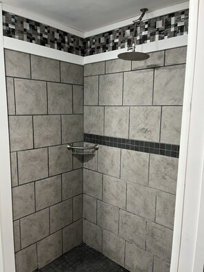 Shower, rainfall showerhead, towels, soap