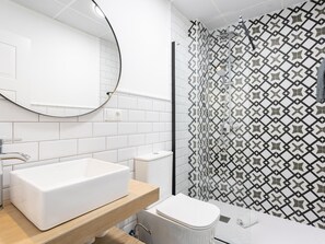 Shower, hair dryer, towels, toilet paper