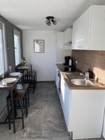 Apartment | Private kitchen | Full-size fridge, microwave, oven, stovetop