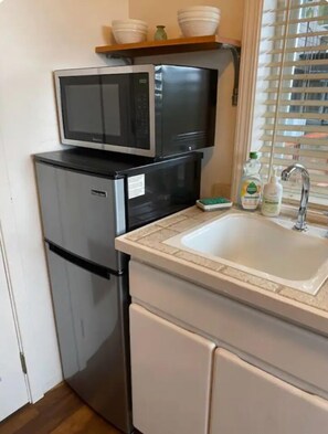 Fridge, microwave, coffee/tea maker, dining tables