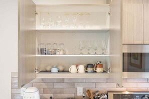 Fridge, microwave, oven, stovetop - Perch - Roosevelt Retreat: Chic 2-Bed Townhome with Parking and Patio (Seattle)