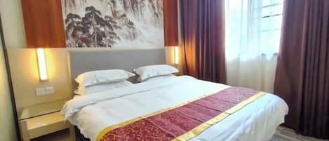 A hotel room with a bed, nightstand, wall art, and a window with curtains.