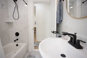 Hair dryer, towels, shampoo, toilet paper