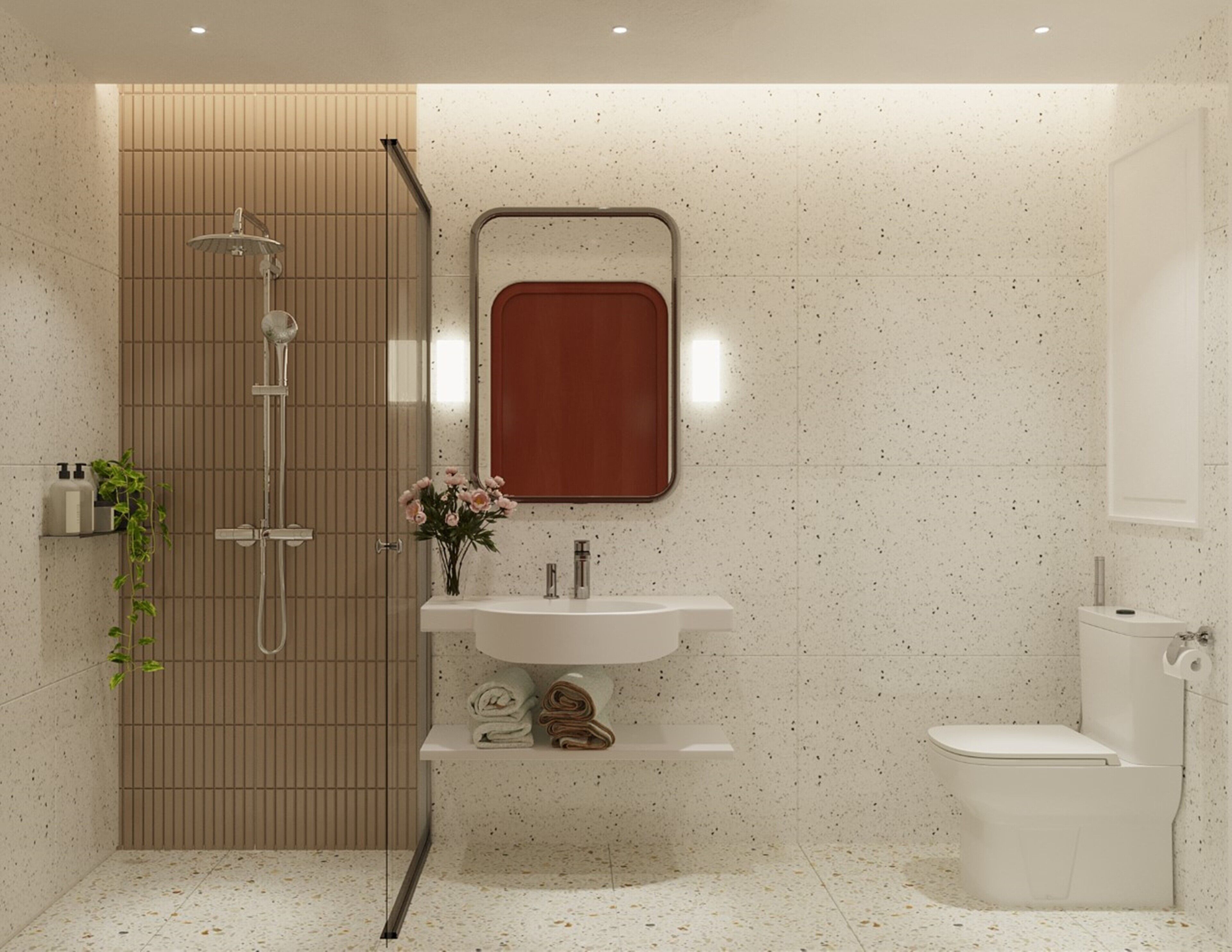 A modern bathroom with a shower, sink, and toilet.