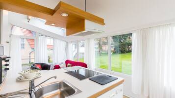 Fridge, stovetop, dishwasher, coffee/tea maker