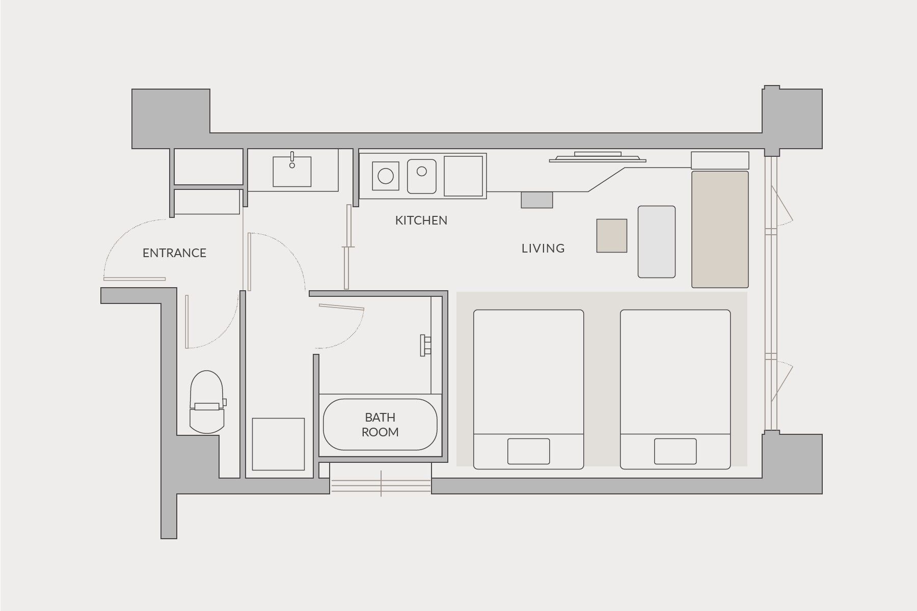 A floor plan of a hotel with an entrance, kitchen, living area, and bathroom.