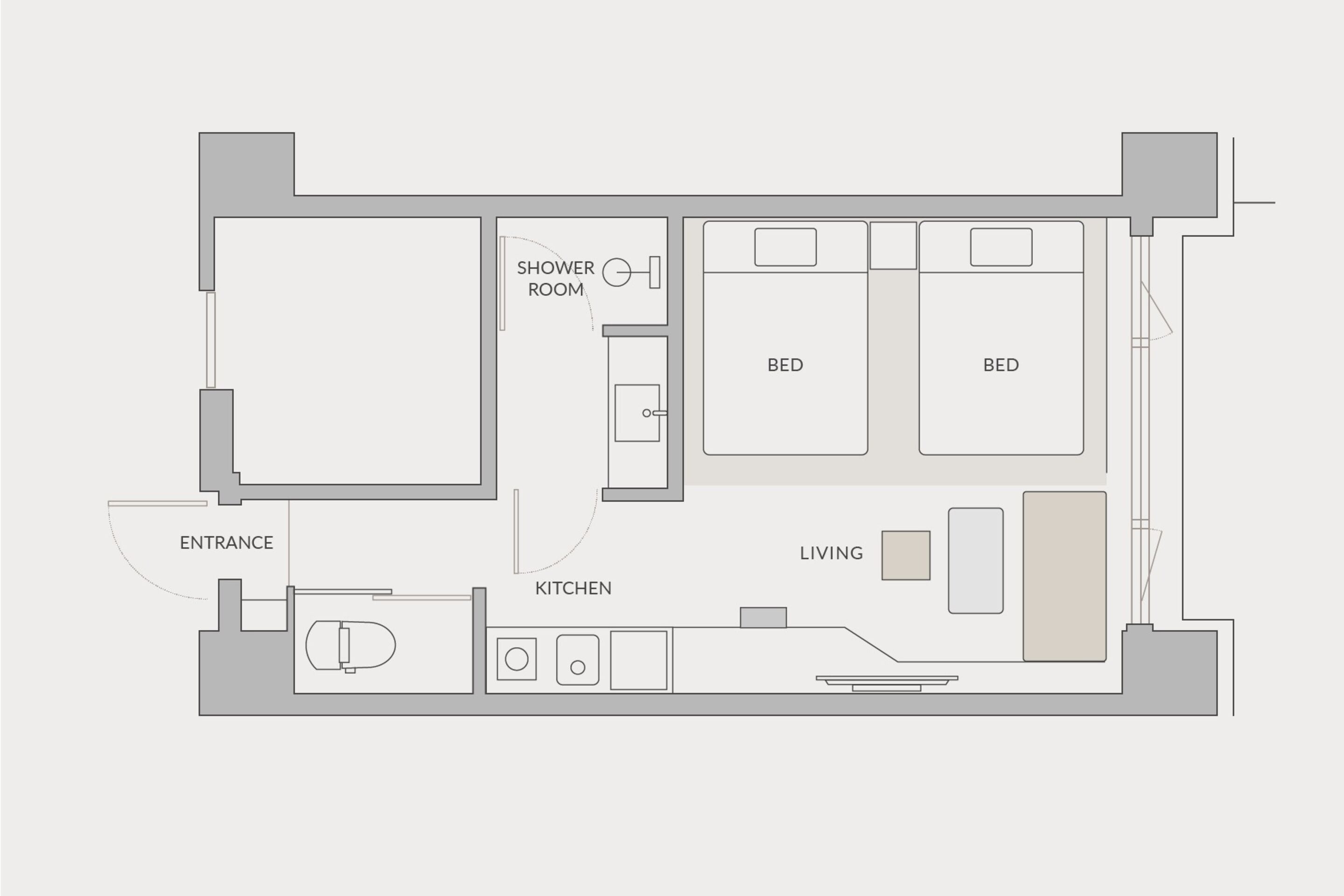 A floor plan with an entrance, kitchen, two bedrooms, a living area, and a shower room.