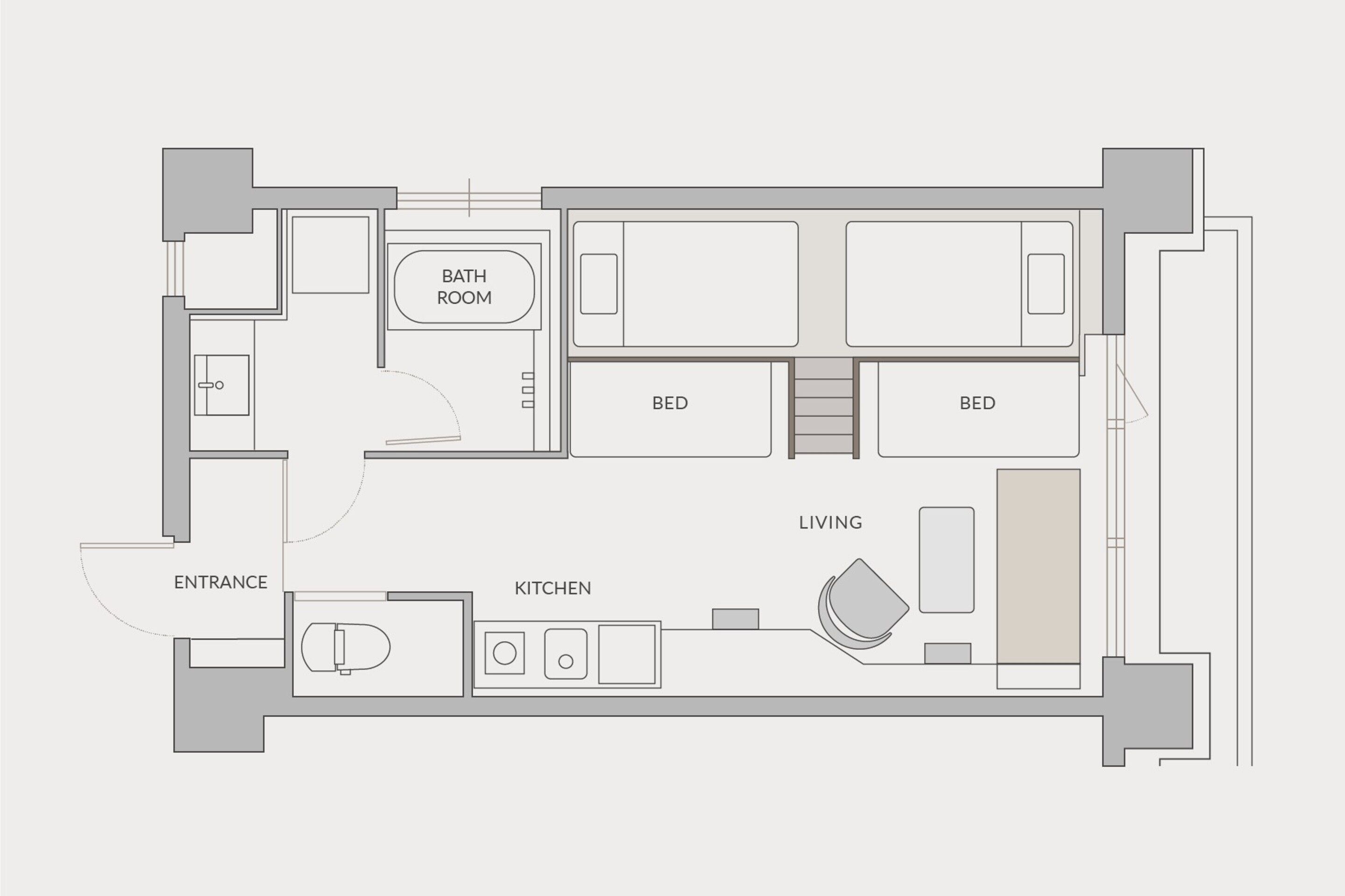 A floor plan of a hotel room with an entrance, kitchen, living area, two bedrooms, and a bathroom.