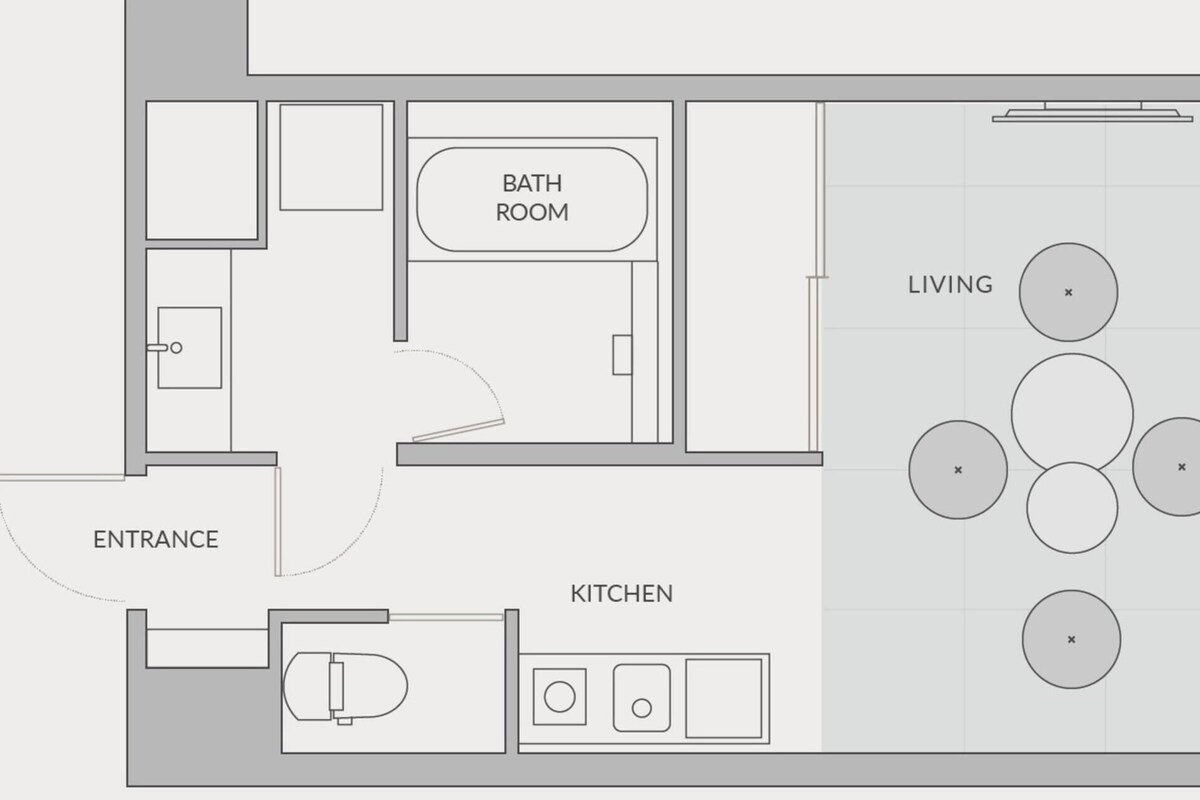 A floor plan with a living area, kitchen, bathroom, and entrance.