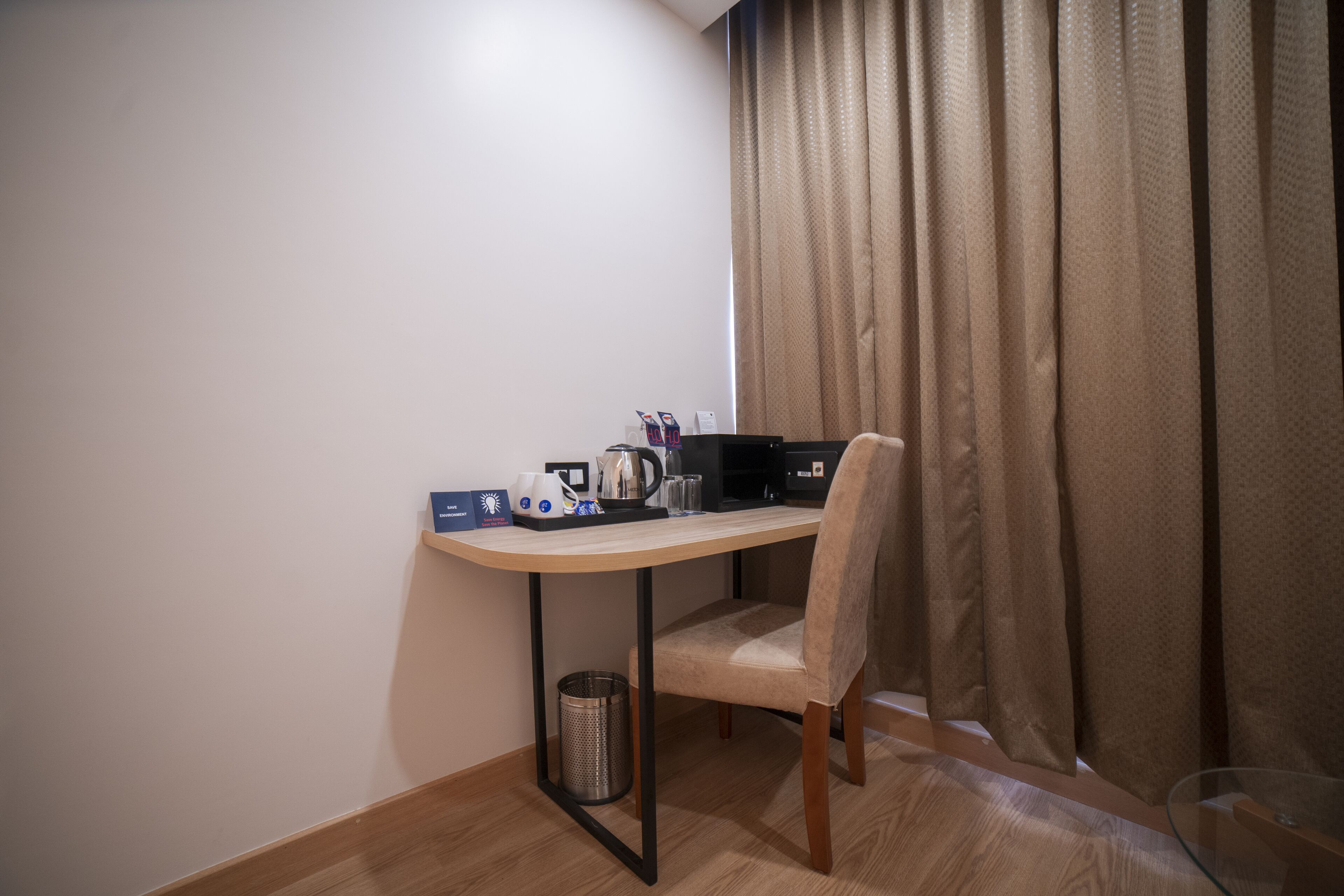 A small, neatly arranged workspace with a desk, chair, and various office supplies.