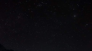 A night scene with a starry sky, a house with a lit exterior, and a sign that reads "Blended Beans Films." - Crystal Cove (Sipalay)