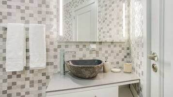 Bathtub, hair dryer, towels