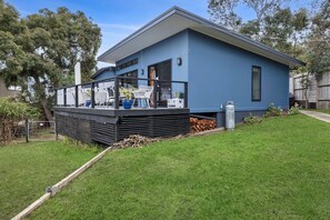 A modern two-story house with a balcony, a garage, and a well-maintained lawn. - Blue Haven at Aireys (Aireys Inlet)