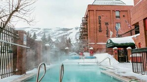 A snow-covered outdoor pool area with a brick building labeled "Shadow Ridge" in the background. - Ski-In/Ski-Out at Shadow Ridge (Park City)