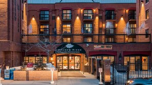 A hotel with a brick facade, multiple windows, and a sign for 'Shadow Ridge Hotel & Conference Center'. - Ski-In/Ski-Out at Shadow Ridge (Park City)