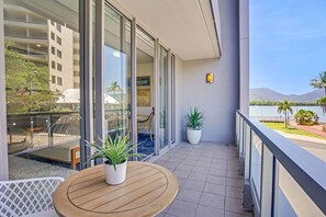 Outdoor dining - 219 Harbour Lights| Waterfront Escape in Cairns | Pool + Balcony (Cairns City)