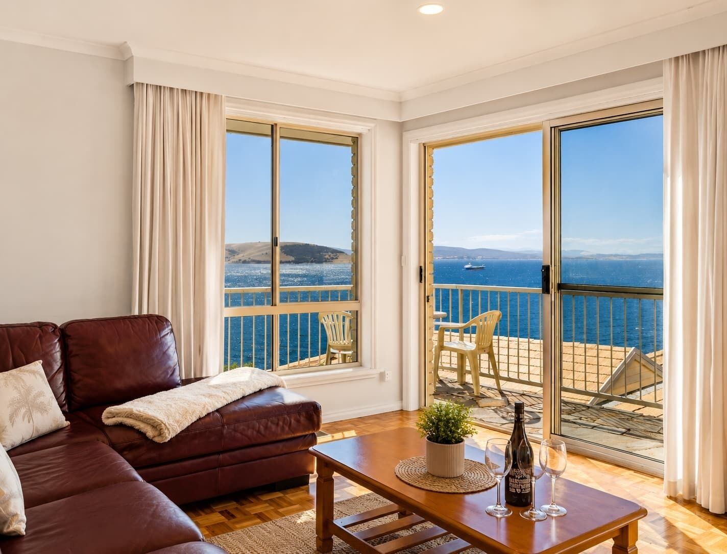 Wake up to breathtaking panoramic views across the River Derwent. Relax in the light-filled living area with direct balcony access and stunning water views.