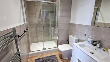 Shower, hair dryer, towels, soap